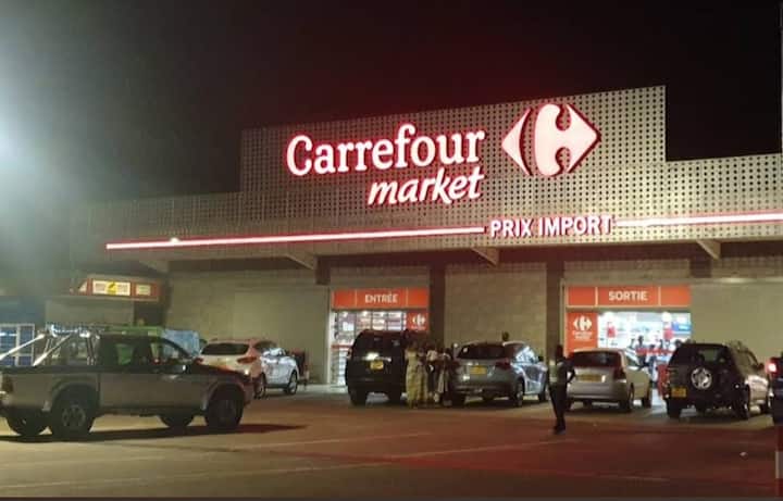 Carrefour Market Prix Import in Owendo at night