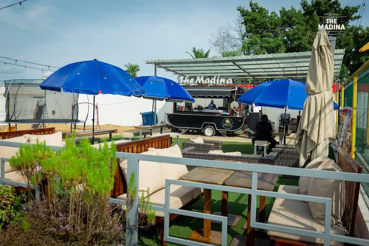 Terrace of The Madina food truck in Owendo
