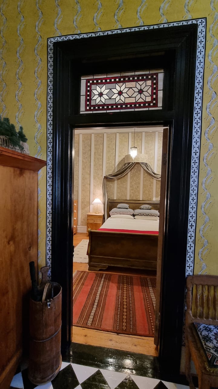 This building used to be my gallery. But one day I started painting these walls in tendrils and flowers and here we are now, it's a bedroom. 