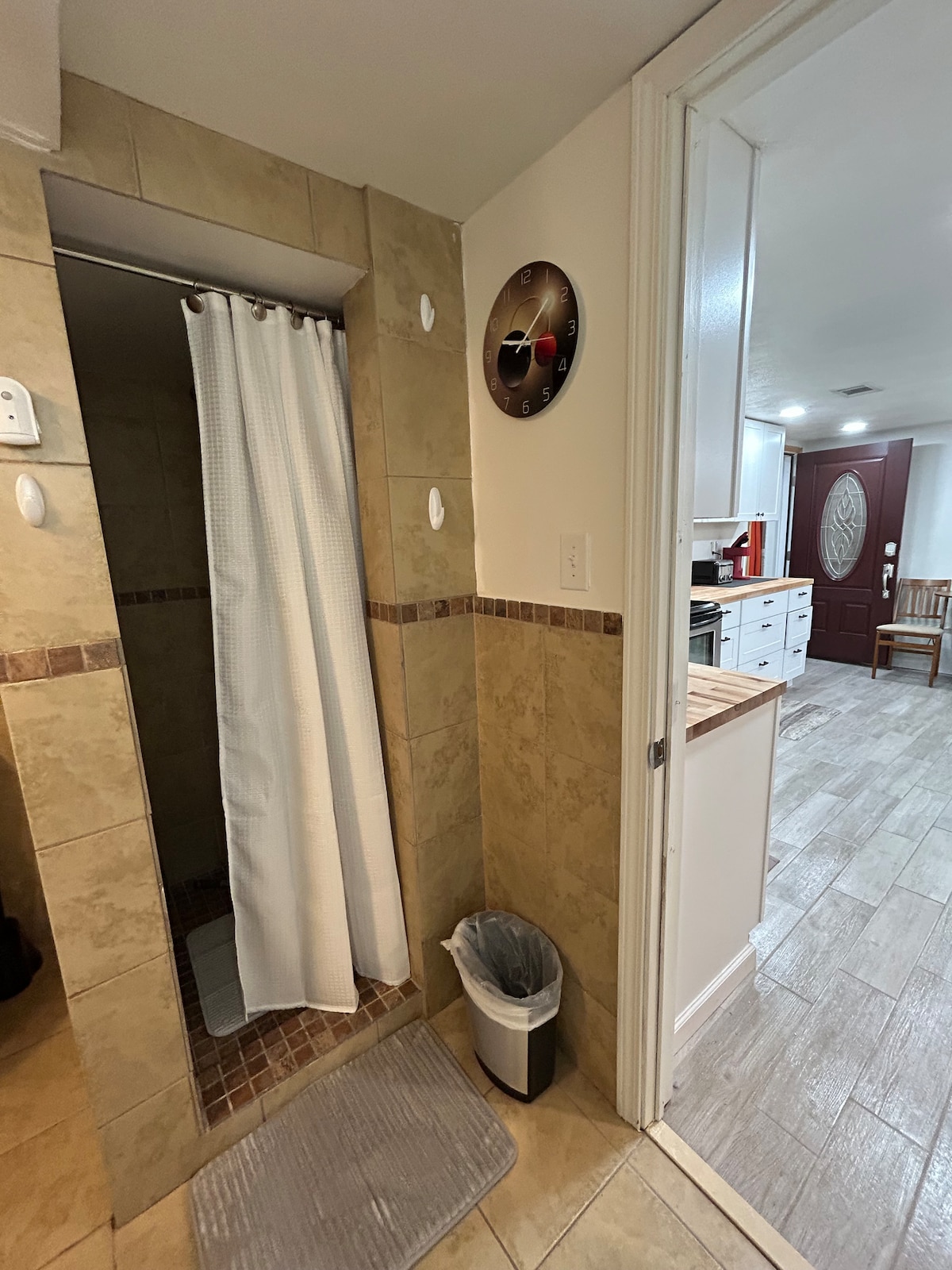 Bathroom + kitchen view through door