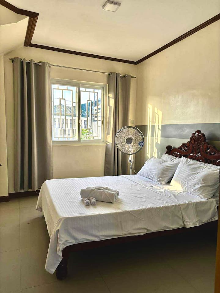 This bedroom is located downstairs 