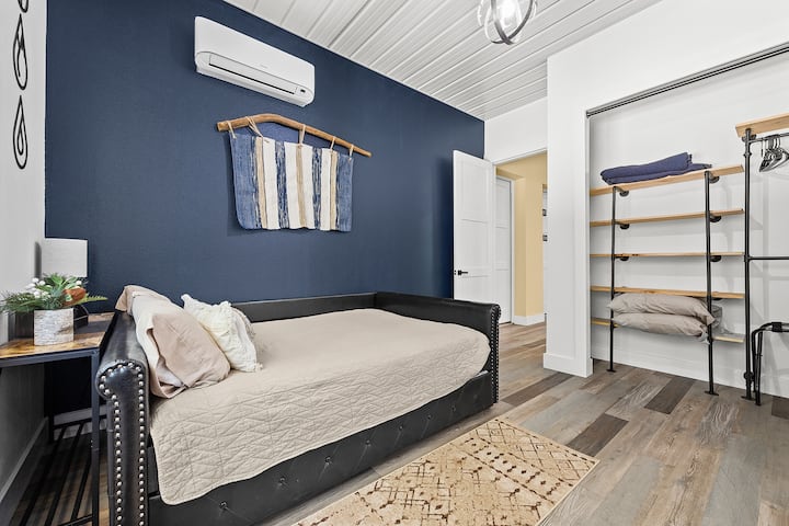 Bedroom 3 has a full-sized bed with single trundle underneath that easily slides out for use. This room also has a workstation with stand-up desk to support work or school needs while you stay. This room also has a private bath.