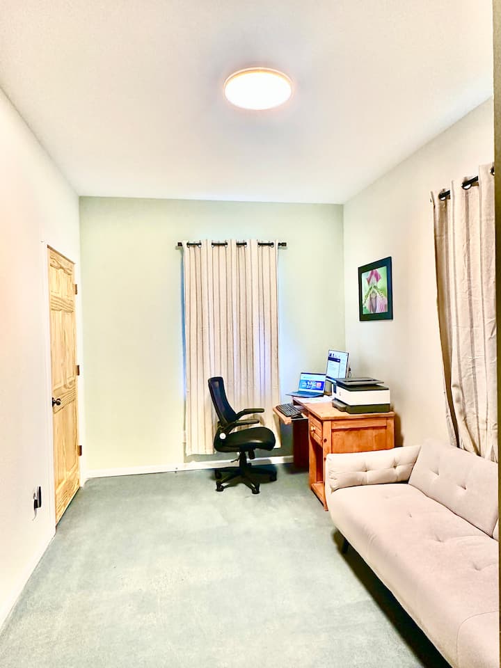 Office upstairs with a twin size futon,  luggage racks, and a small portable fan for your use and for white noise while you’re sleeping.