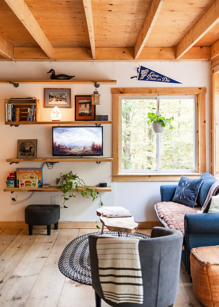 Enjoy a book in the sunlight or when it's time for entertainment, swivel the TV for easy viewing. Or enjoy our selection of games and puzzles for some analog fun! The loveseat conveniently pulls out into a full sofa bed. Photo by Chris & Pam Daniele