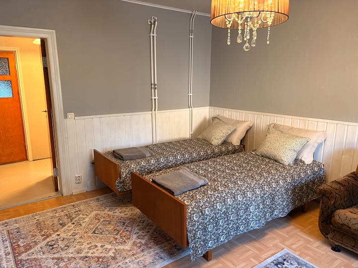 This bedroom is in the same space as the living room. If necessary, the sleeping area can be closed with curtains. 