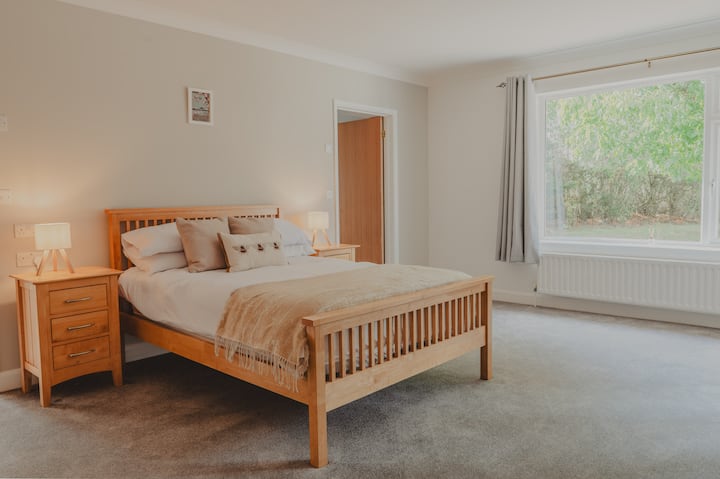 Warm and welcoming double room awaits you, with beautiful views of the peaceful countryside outdoors.