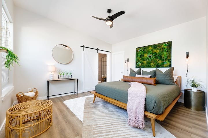Our master is finished with a Nectar California King bed (the most requested item from our guests) plus side reading lights, essential oil diffuser and sound machine. Our green moss and succulent mural is the focal point for this room. So cozy!