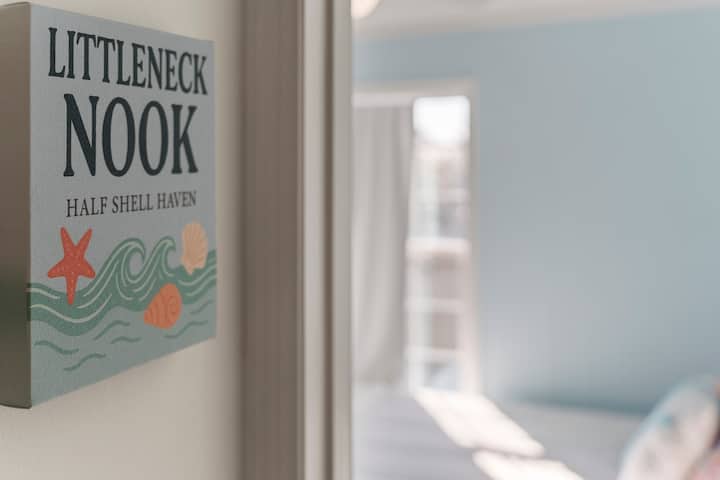Our “Littleneck Nook” includes a workspace, clothing storage, a reading lamp, and a pack-and-play, perfect for staying organized and comfortable, whether you’re working remote or traveling with family.