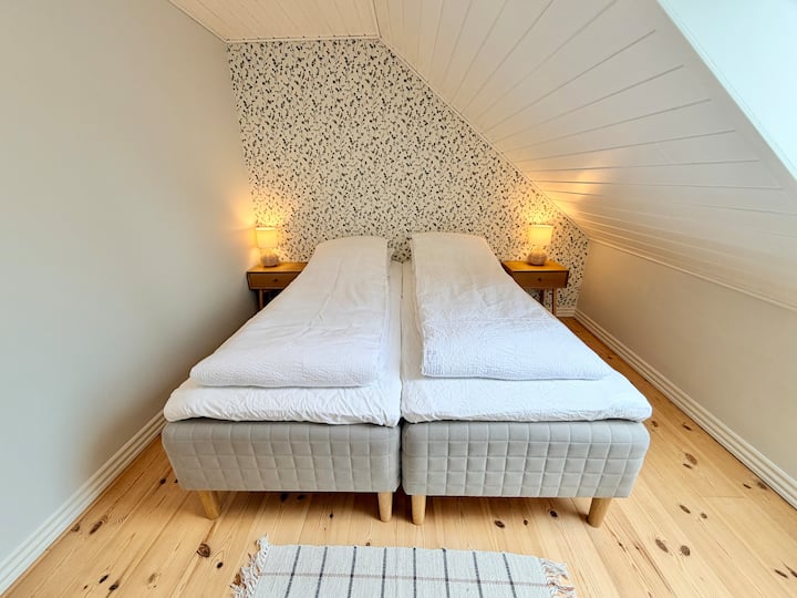Two single beds 80 cm wide that can be used as singles or as a double bed 160 cm - Let us know when you book if you would like to used them as single beds or a double bed.