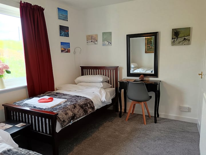 A well appointed room with 2 comfortable single beds, built in wardrobe and dressing table. This room is located at the rear of the property.