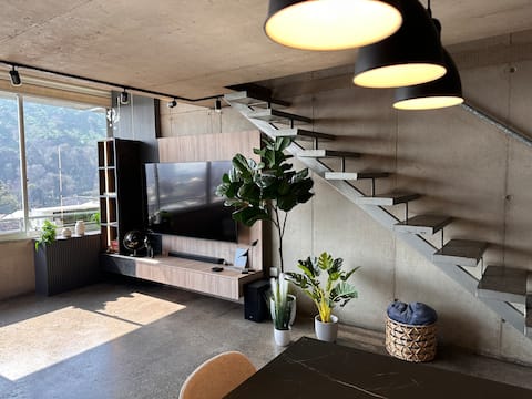 Modern loft with a view of the cerro