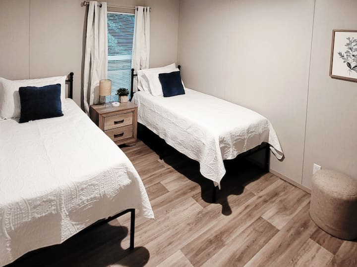 [Bedroom 3] This bedroom includes two twin memory foam beds, a convenient USB-C charger, and a large closet for ample storage.
