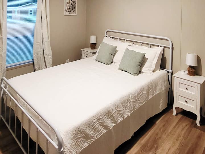 [Bedroom 2] This bedroom features a comfortable queen-size memory foam bed, a convenient USB charging port, and a large closet for all your storage needs.
