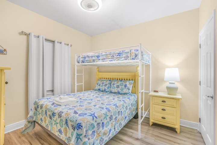 Bright and cheerful, this bedroom is perfect for families or friends to relax and unwind after a fun day of exploring