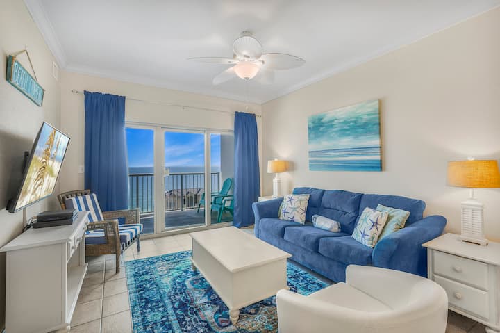 Relax in this coastal-inspired living room, open the balcony doors, feel the ocean breeze, and enjoy the perfect blend of comfort and Gulf views