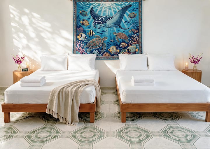 Sink into your plush matrimonial beds, wrapped in soft, fresh linens designed for total comfort. After a day of sun and adventure, your serene tropical suite awaits—so you can wake up feeling refreshed.