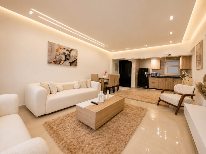 Paradise 2BDR In Rehab City: Living room