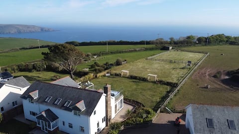 Top Airbnb: Devon House Hot Tub Sea Views & Family Fun in Wembury