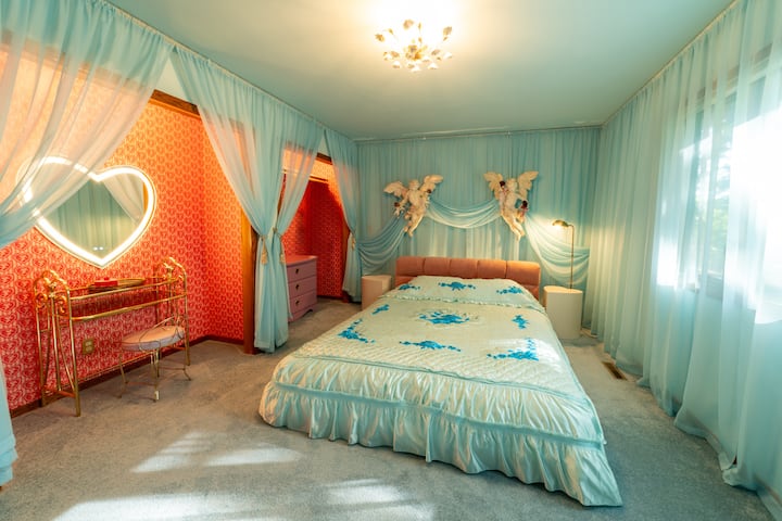 Blue Valentine Bedroom with a heart shaped vanity mirror
