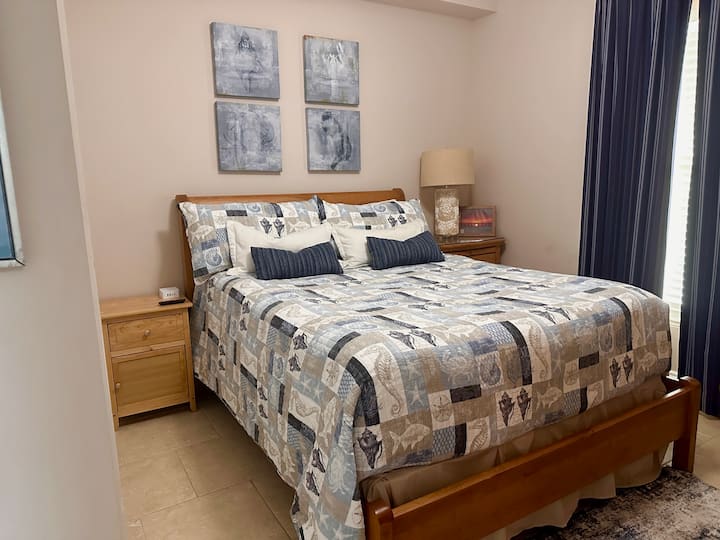 Queen bed with 3-inch memory foam topper.