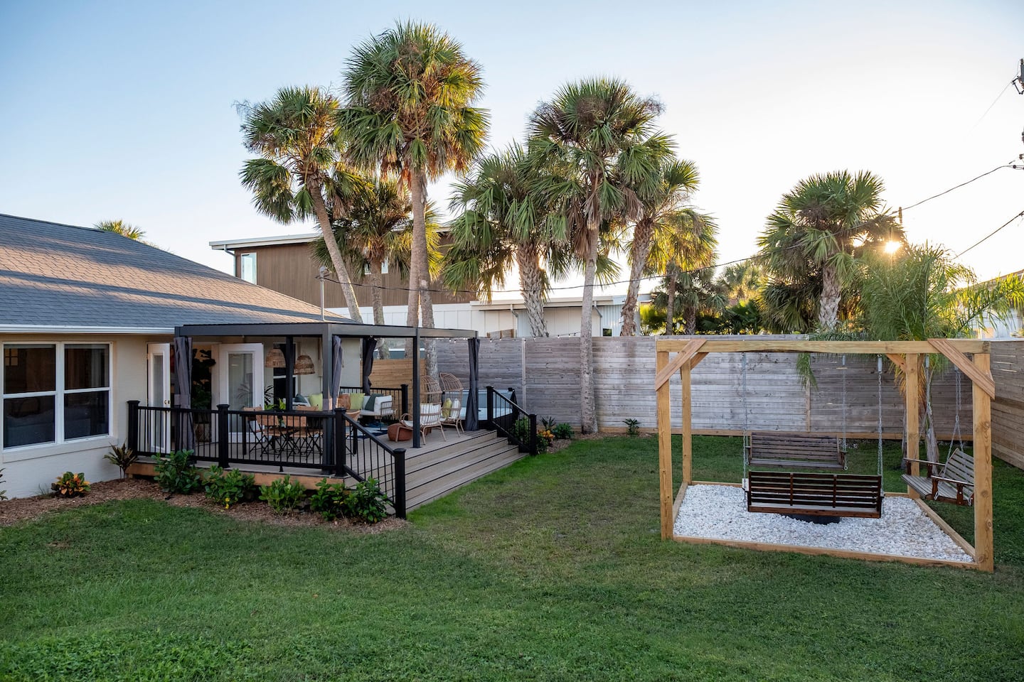 Fenced backyard with hot tub, covered deck and fire pit, Luxury Beach Haven, Palm Coast, Florida