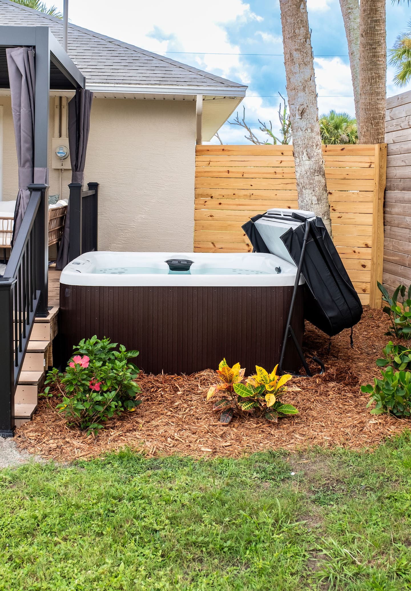 Fenced backyard with hot tub, covered deck and fire pit, Luxury Beach Haven, Palm Coast, Florida