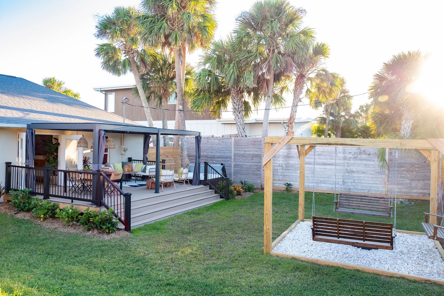 Fenced backyard with hot tub, covered deck and fire pit, Luxury Beach Haven, Palm Coast, Florida