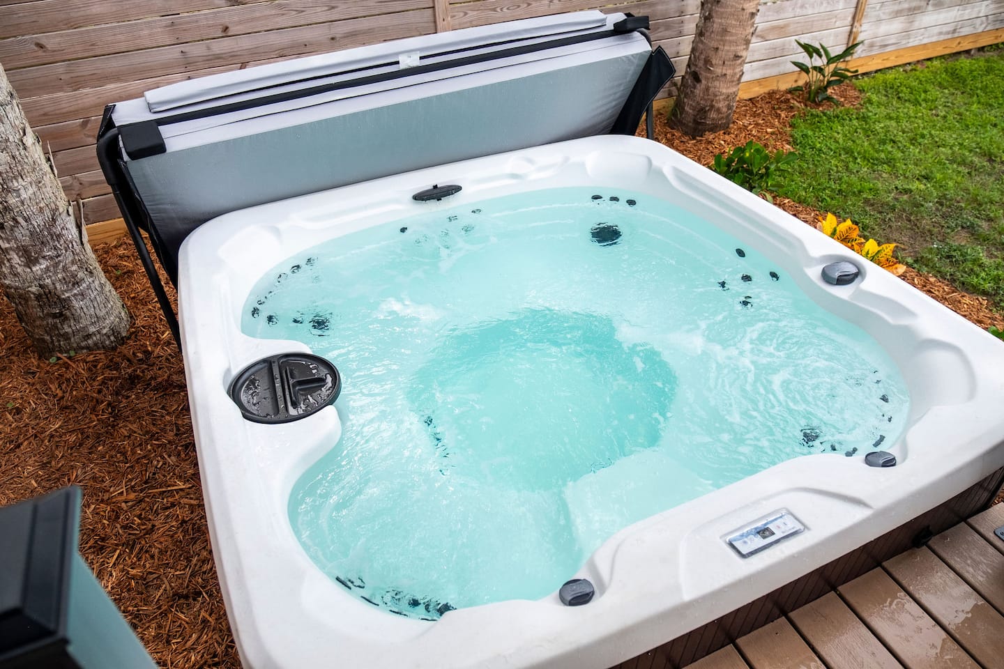 Fenced backyard with hot tub, covered deck and fire pit, Luxury Beach Haven, Palm Coast, Florida
