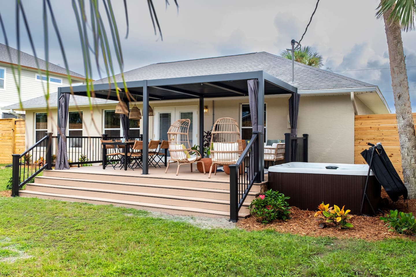 Fenced backyard with hot tub, covered deck and fire pit, Luxury Beach Haven, Palm Coast, Florida