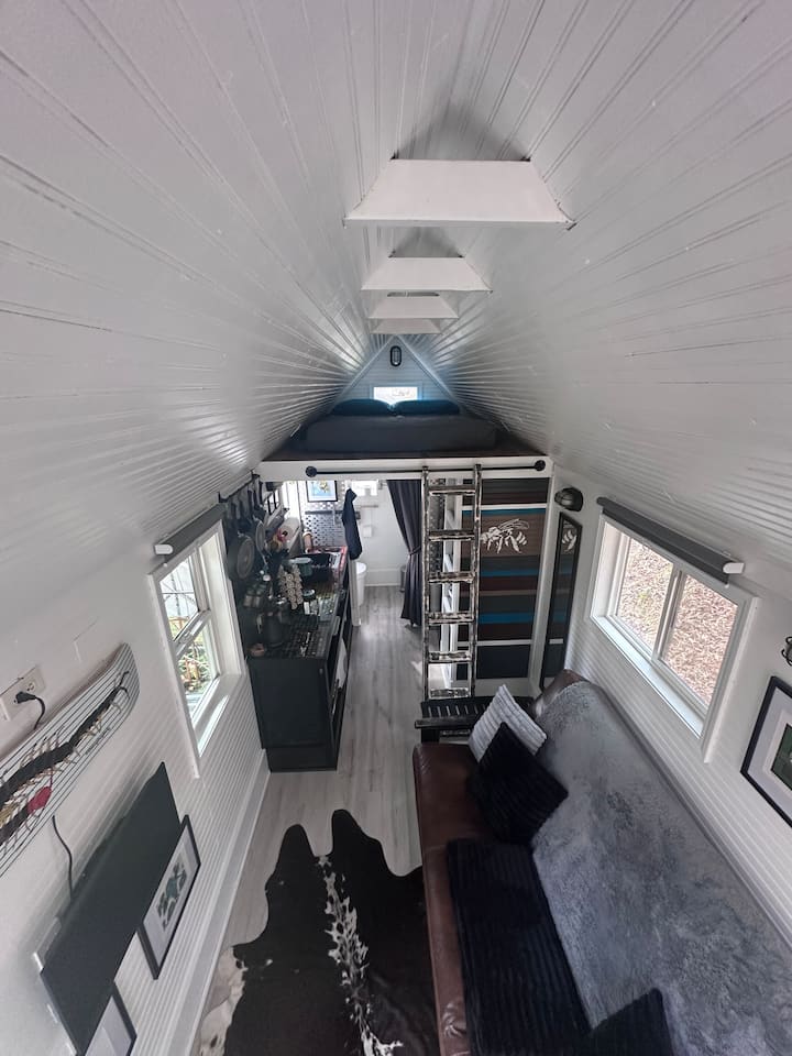The cozy loft has a memory foam mattress and is accessed by a ladder.