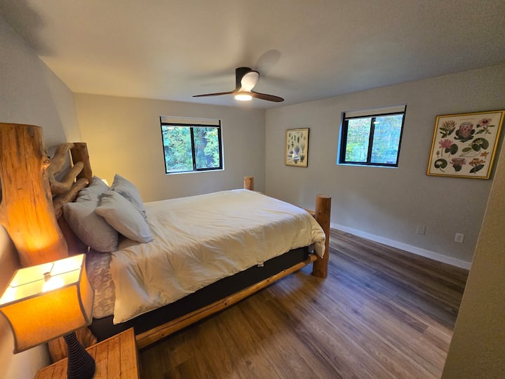 Queen bed and large closet with plenty of storage space. Nature views out the windows.