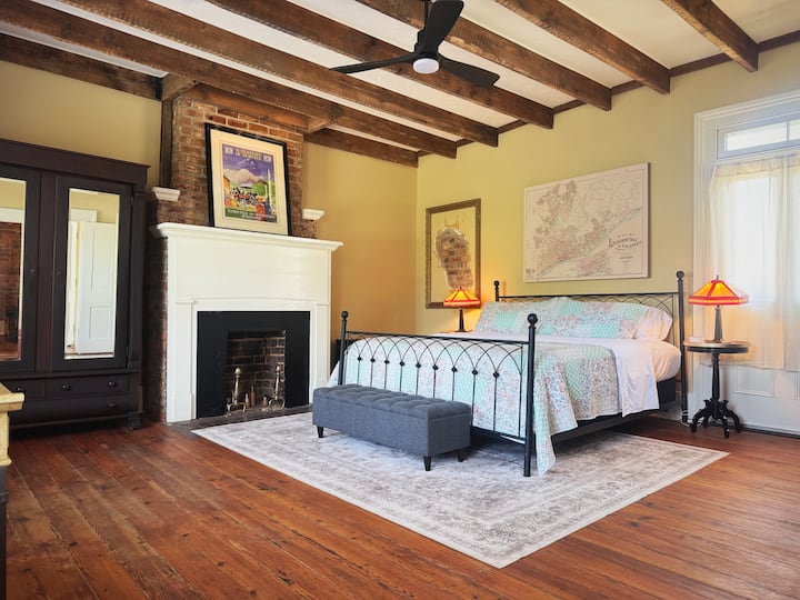 A King bed, mission style lamps, some fun with new/old walls and 300 year old furniture welcome you to a great night's sleep. And a little surprise for those who like to stare at the ceiling. 