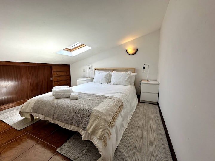 Upper floor bedroom with double size bed.