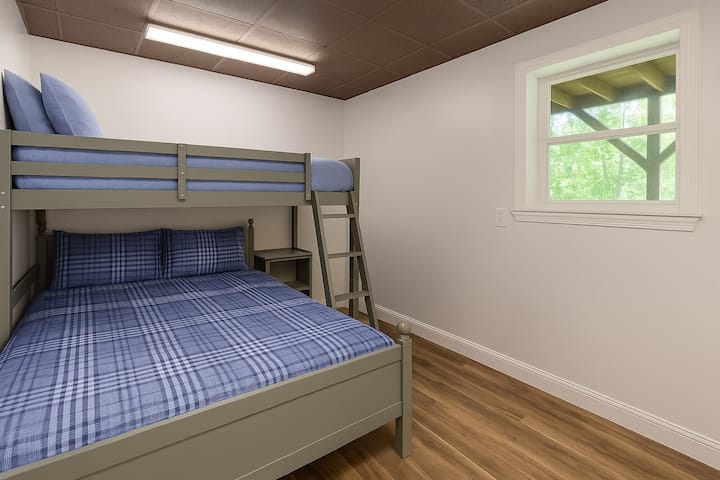 Twin over full bunk bed, located in small bedroom off downstairs game room.