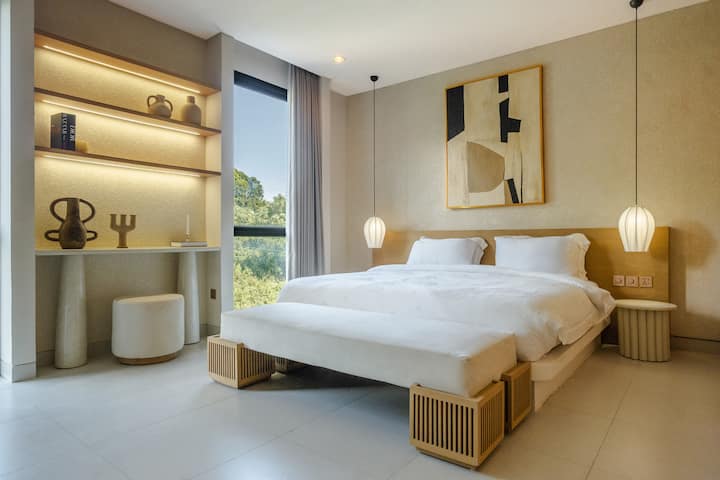 Sleep like a 5-star stay—full-latex King Koil king bed (soft/hard firmness option), crisp hotel linen, and floor-to-ceiling built-in closets for long stays.