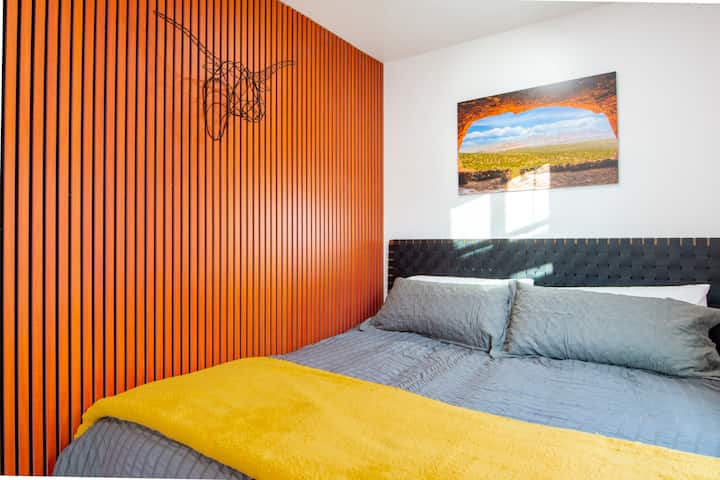 King size Tuft & Needle mattress with cozy cotton linens, extra pillows and blankets.