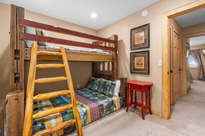 This cozy bunk room is perfect for kids or extra guests, offering comfortable beds, playful decor, and plenty of space to relax after a full day of mountain adventures.
