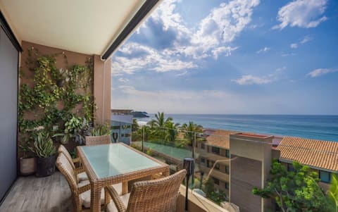 Luxury Penthouse, ocean view, step from the beach.