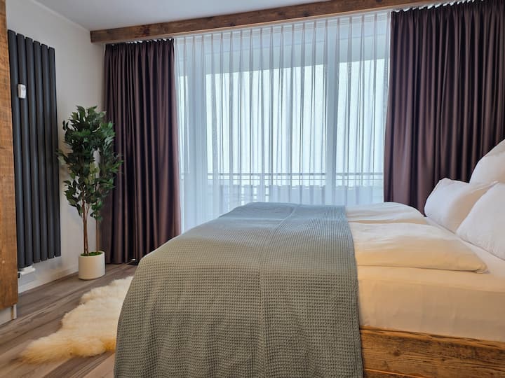 Bright bedroom – cozy with large window and blackout curtains.