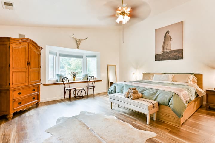 This Master Bedroom (King) is truly an oasis complete with a full bathroom, King sized bed, large vanity, and the dream walk-in closet