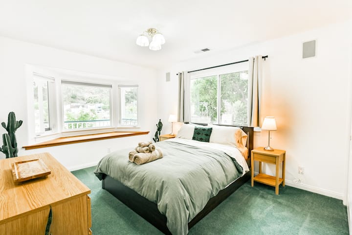 Bedroom 2 (Queen) has views from the front of the house looking out towards the winery but still private and surrounded by nature