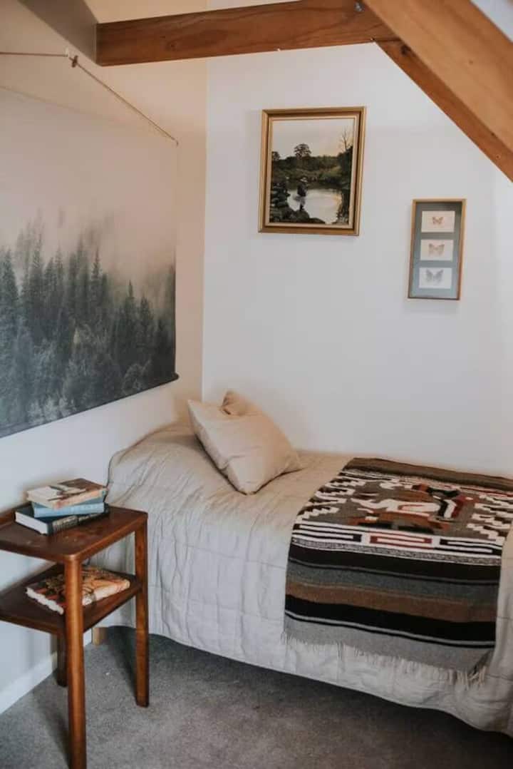The fourth bedroom offers two single beds, perfect for children.