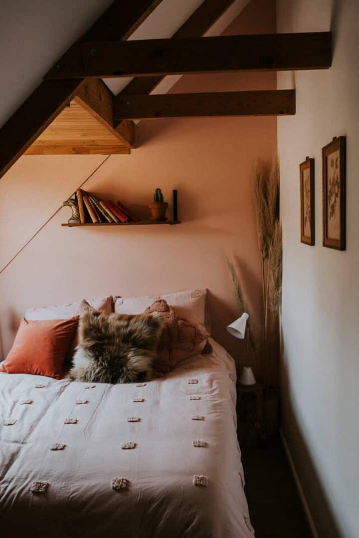 The third bedroom features a queen bed under vaulted ceilings.