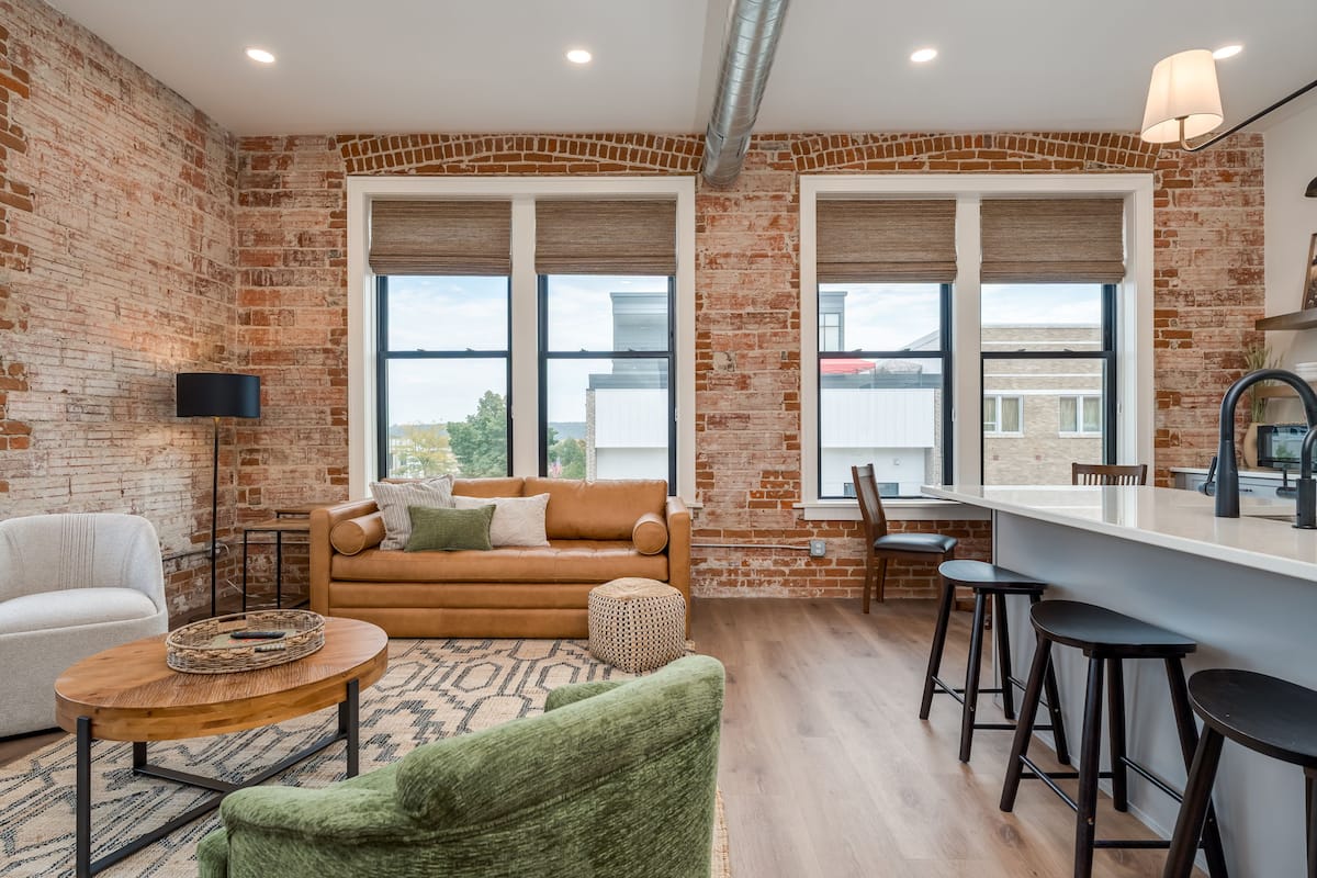 Living area with exposed brick in a fragrance-free New Ulm loft