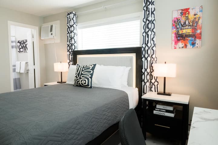 Queen bed with convenient access to the bathroom for added comfort and ease.