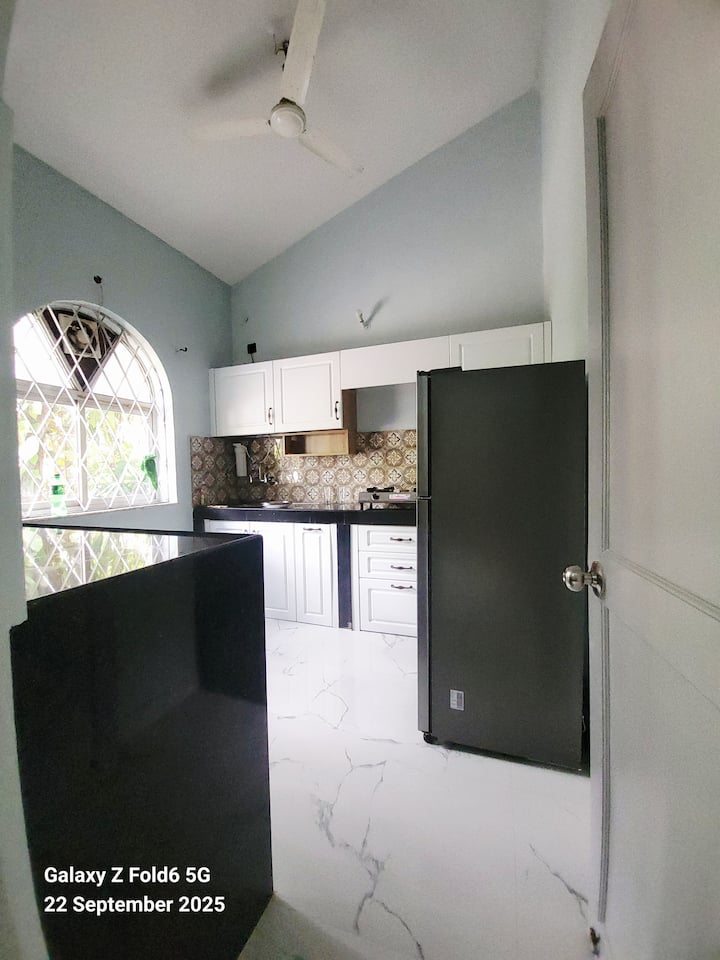 fully furnished kitchen with stove top and utensils