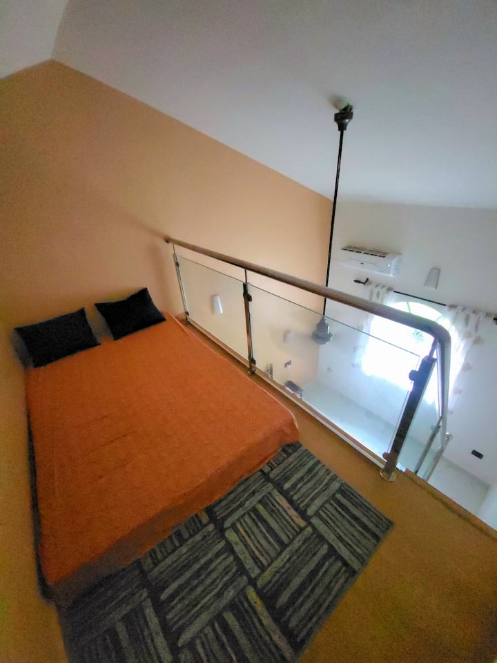 A loft with a double bed that can fold into sofa.