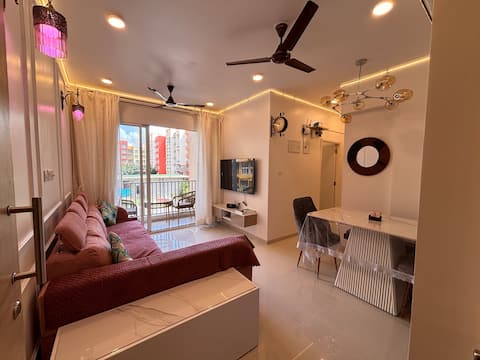 Resort style Pool view 2bhk Apt near GOI Airport