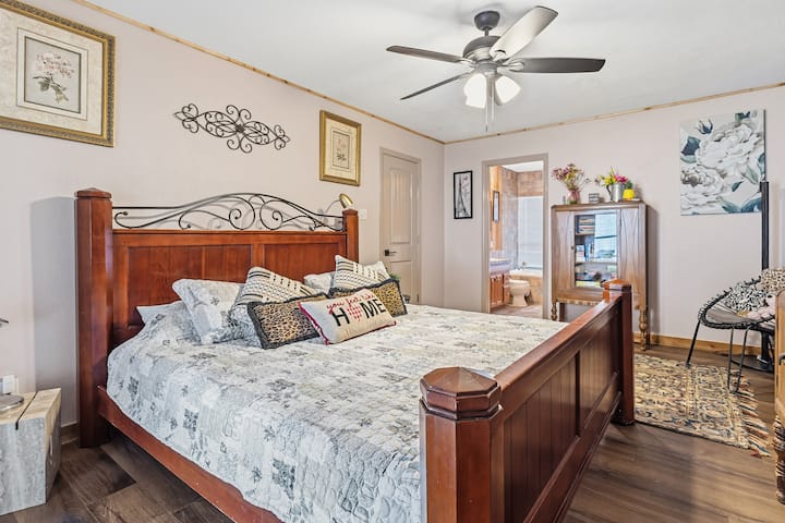 Downstairs King-size master bedroom - linen and pillows provided, TV, games, French doors to patio with full windows for beautiful mornings. 
NOTE: Most games, puzzles, and books are stored in this room.