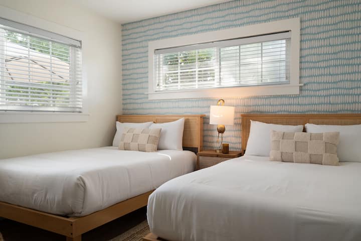 Two full size beds and a Smart TV for your entertainment.  This bedroom has an ensuite bathroom with walk in shower.